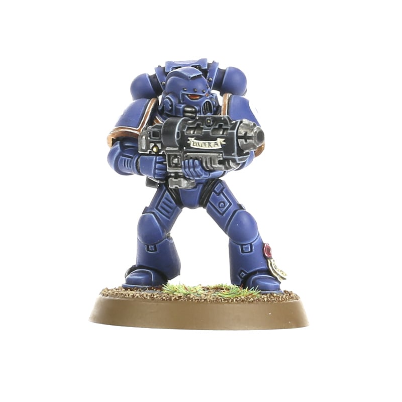 Warhammer 40,000 - Space Marines - Tactical Squad - Blue armored Space Marine figurine holding a large black rifle, standing on textured grass base.