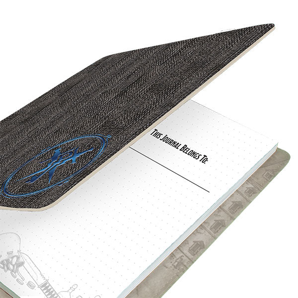 D&D Class Premium Campaign Journal - Rogue Class (PREORDER) - Black textured softcover journal with blue embossed emblem and dotted grid pages inside.