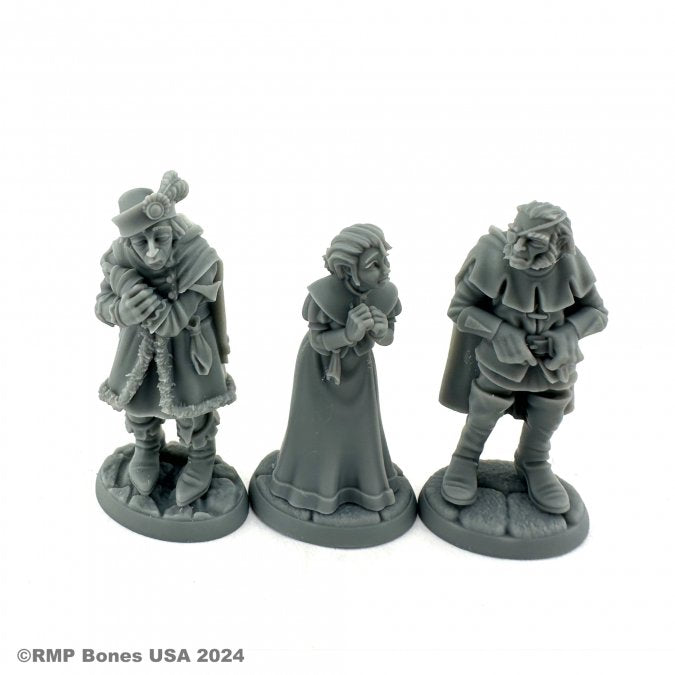 Townsfolk: Captives (3) - A man in chains and tattered clothes, a hooded woman with folded hands, and a shackled man with a cloak and headband.