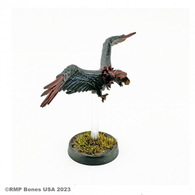 Gallowhawk - Black and brown bird miniature with outstretched wings mounted on clear stand above grassy base.