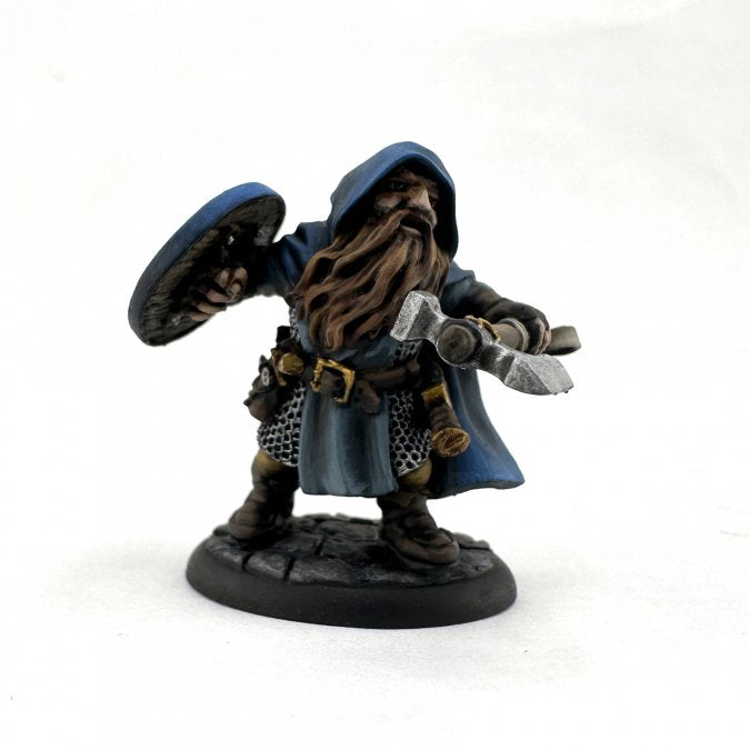 Baldon, Dwarf Hero - Dwarf warrior figurine in blue hooded cloak with detailed beard, wielding axe and shield on round base.