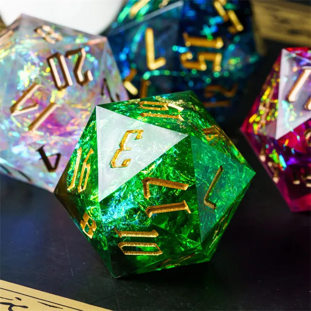 33mm Green Shimmer D20 - 33mm translucent green 20-sided die with gold shimmer and gold numbers.
