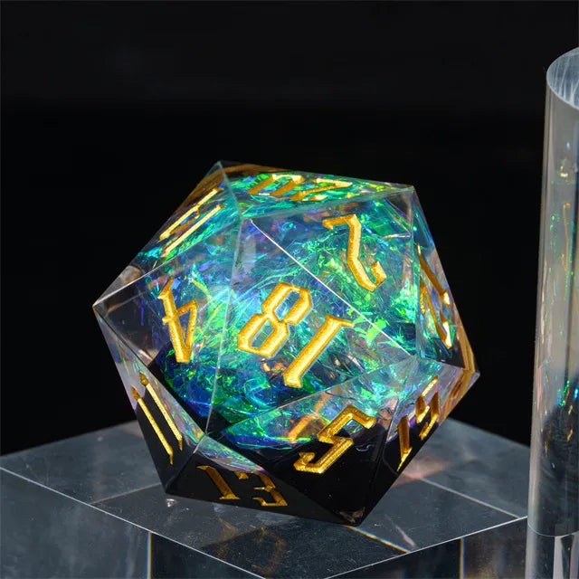 33mm Clear & Black Shimmer D20 - 33mm clear d20 dice with black shimmer base and gold numbers.
