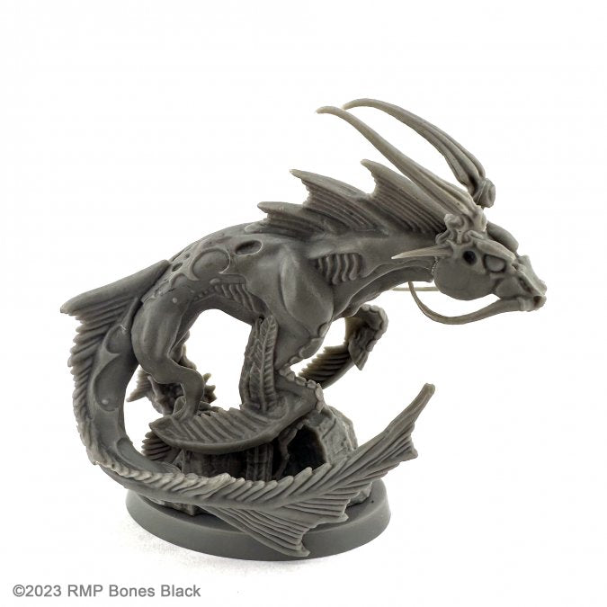 Hippocampus - Dark gray resin sculpture of a stylized seahorse with dragon-like wings and elongated tail on a round base.