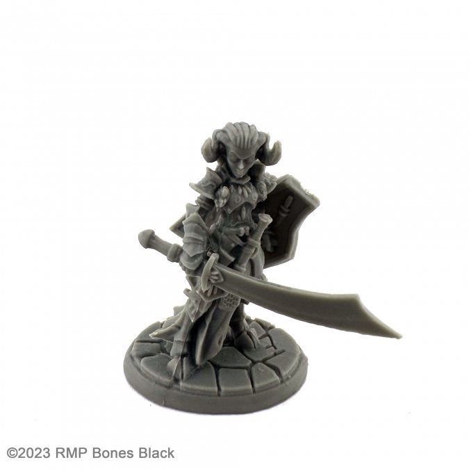 Hellborn Paladin - Gray unpainted miniature figurine of armored warrior with horned helmet, large sword, and shield on round base.