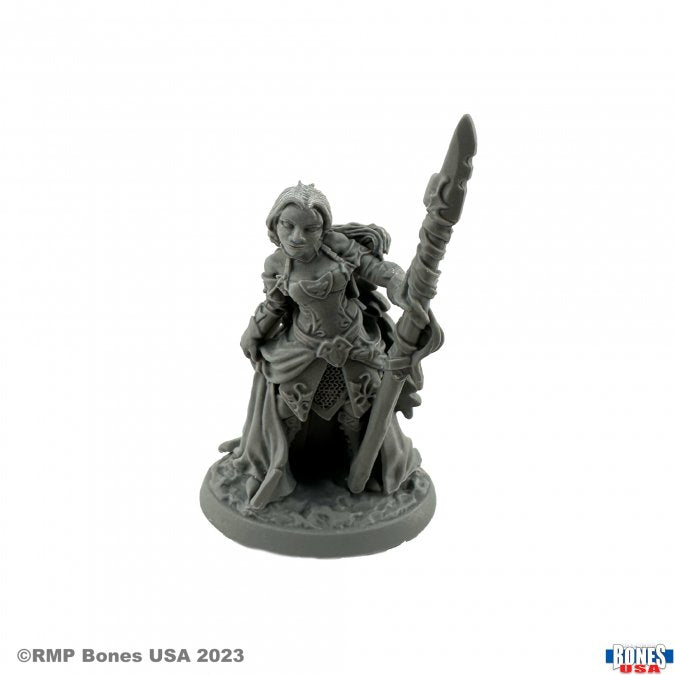 Devona, Human Wizard - Gray resin miniature of a female wizard kneeling with a staff, wearing flowing robes and detailed armor.