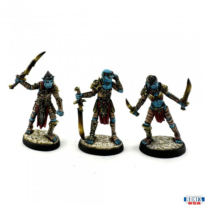 Astral Reavers (3) - Three detailed miniature warrior figures in blue armor and cloth, each wielding curved swords and posed on round bases with.