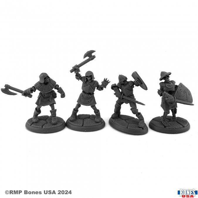 Skeleton Guardians II (4) - Four dark gray plastic skeleton warrior miniatures holding weapons and shields, posed in battle stances on round bases.