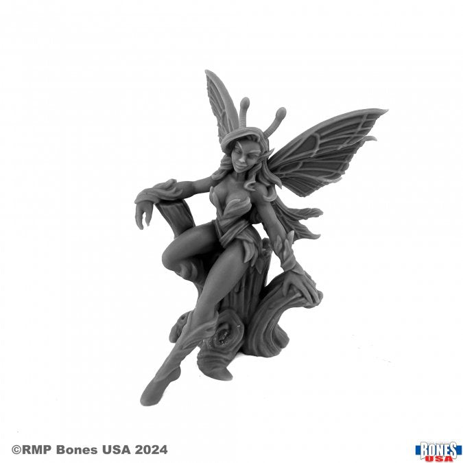 Fairy (Translucent) - Detailed translucent fairy figurine perched on a textured branch with large delicate wings and flowing hair.