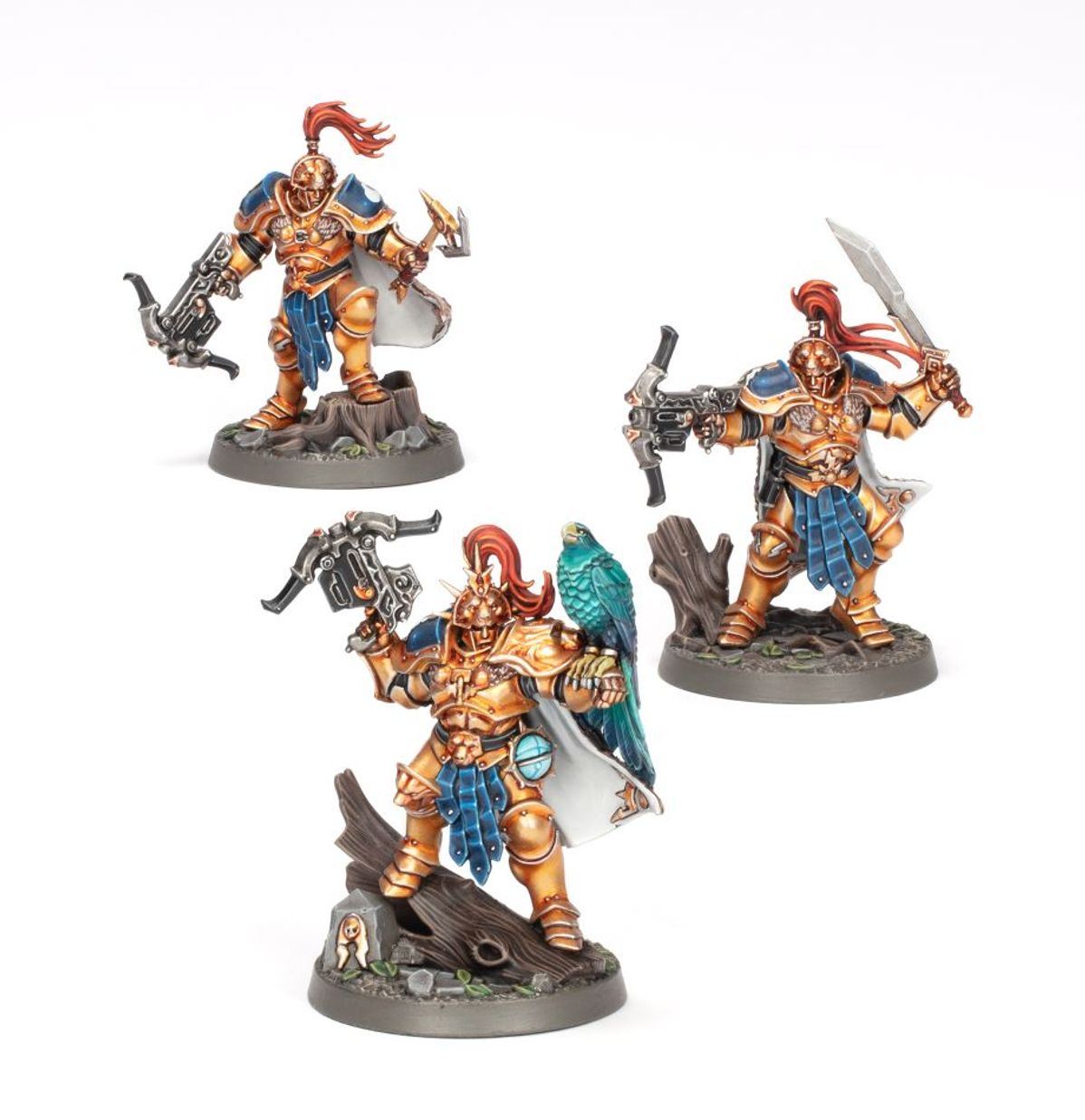 Warhammer Underworlds - Starter Set - Three detailed Warhammer Underworlds miniatures painted in blue and bronze armor, each wielding different weapons and.