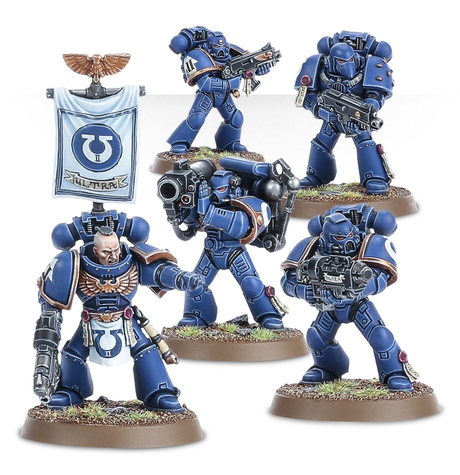 Warhammer 40,000 - Space Marines - Tactical Squad - Set of six detailed blue-armored Space Marine miniatures with futuristic armor, weapons, and base terrain accents.