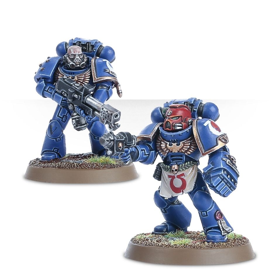 Warhammer 40,000 - Space Marines - Tactical Squad - Two Blue-armored Space Marine miniatures with detailed weapons and helmets, standing on textured bases.