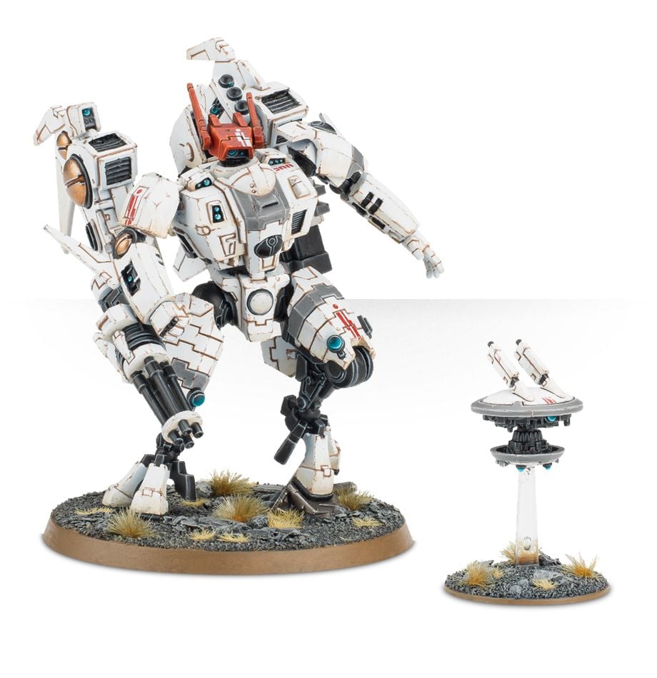 Warhammer 40,000 - T'au Empire - Commander - White and orange robotic Warhammer 40K T'au Empire Commander miniature with weapon and drone on textured base.