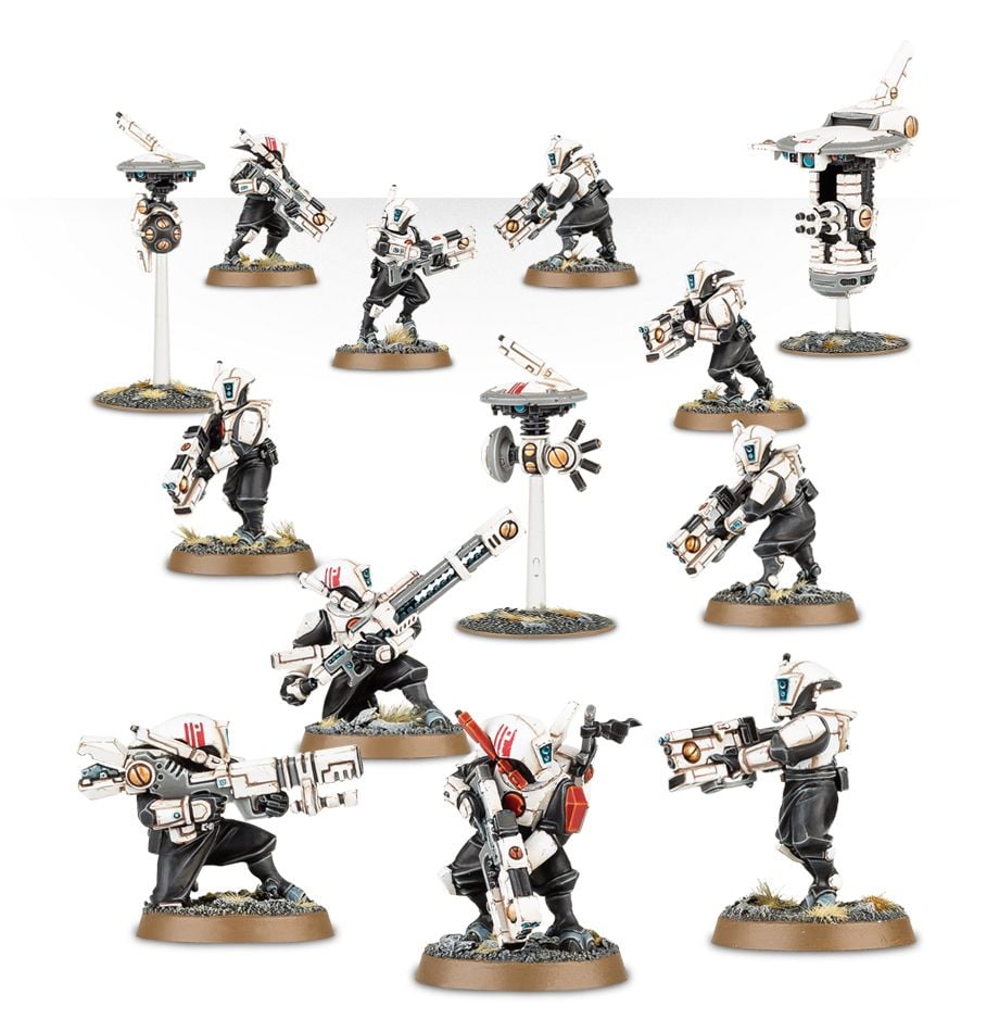 Warhammer 40,000 - T'au Empire - Pathfinder Team - Warhammer 40,000 T'au Empire Pathfinder Team miniatures with white armor and orange accents, various weapons, and drones on.