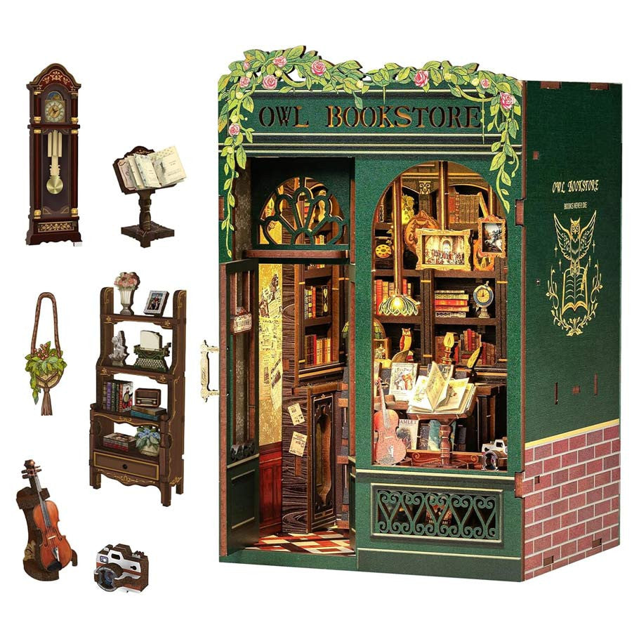 Owl Bookstore Book Nook (PREORDER) - Miniature owl-themed bookstore diorama with intricate wooden shelves, books, and warm lighting.