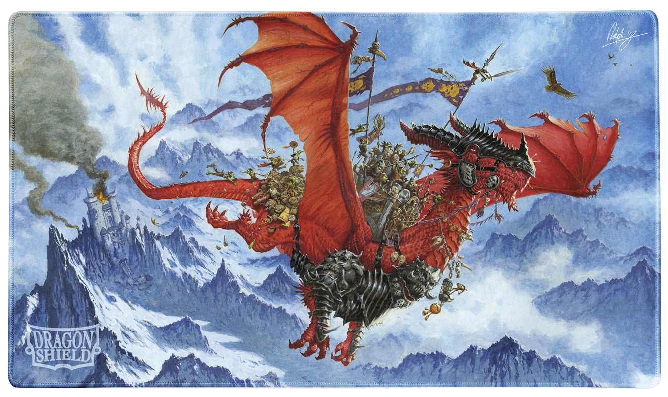 Dragon Shield Playmat w/ Tube - The Raid (PREORDER) - Fantasy-themed playmat featuring a red dragon soaring over snow-covered mountains with a cloudy sky backdrop.