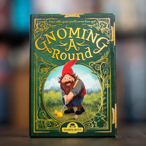 Gnoming A Round - Green card game box with whimsical gnome holding a golf club on front, titled Gnoming A Round.