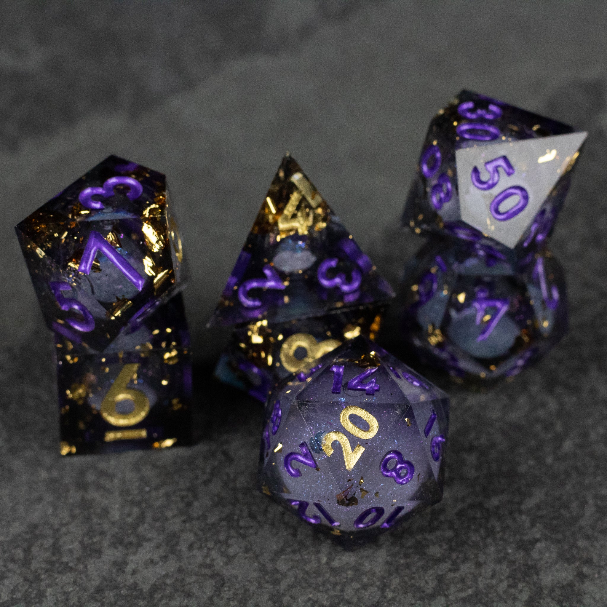 Witching Hour Liquid Core Dice - Set of six sharp-edged dice with purple and gold liquid core, glowing numbers, and a smoky translucent finish.