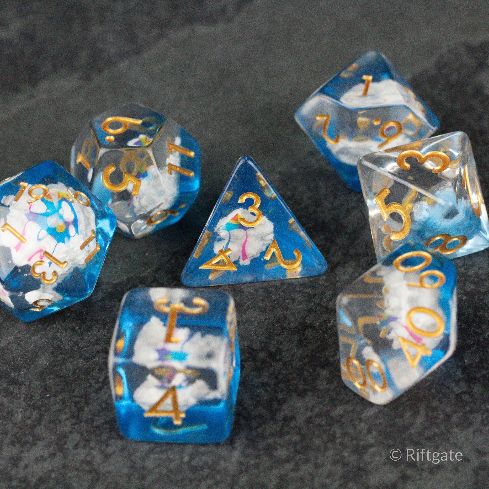 Clouds & Kites Dice - Blue and white marbled polyhedral dice set with gold numbers and cloud and kite designs.