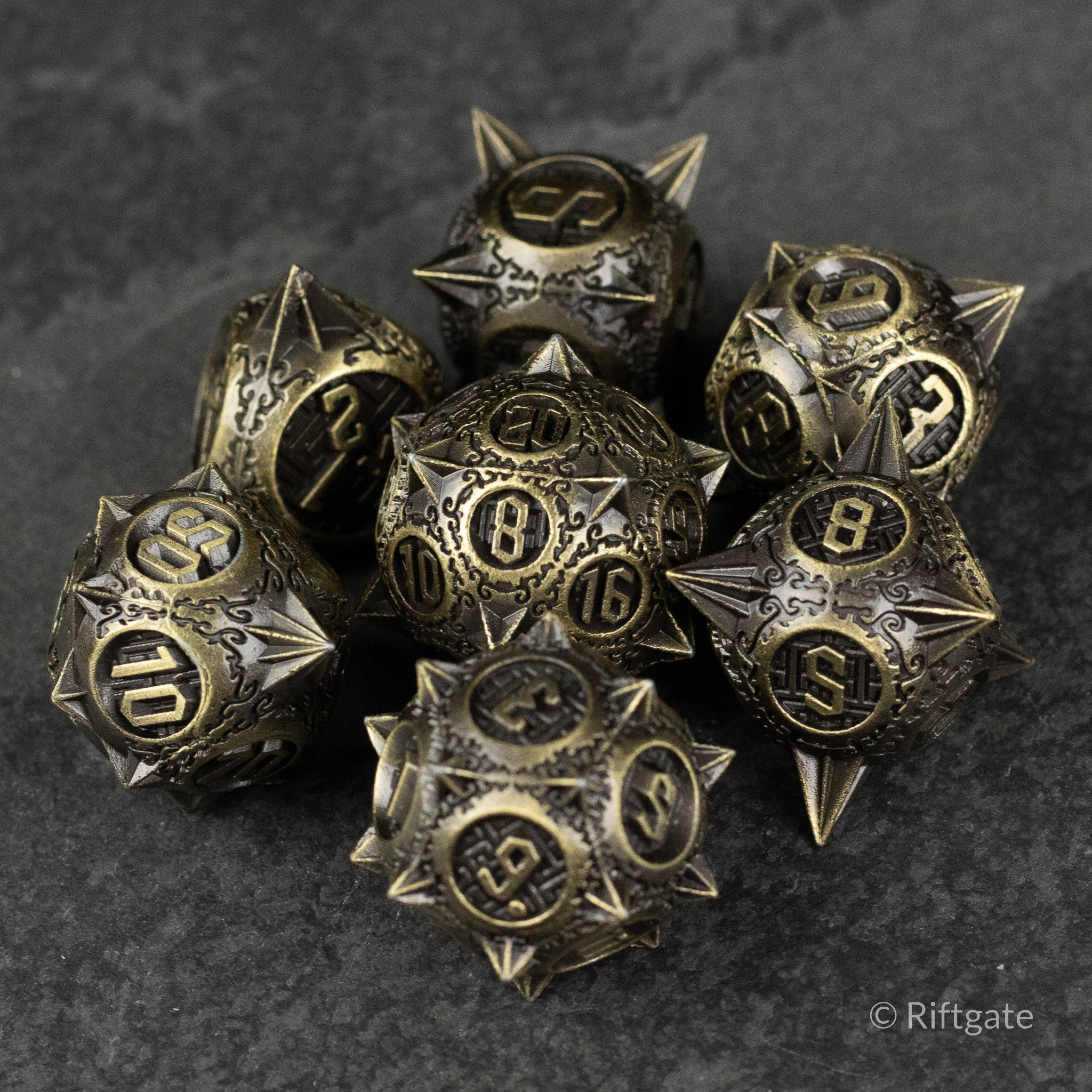 Bronze Morning Star Metal Dice Set - Bronze metal dice set with intricate star and spike design, numbered faces in black and bronze finish.