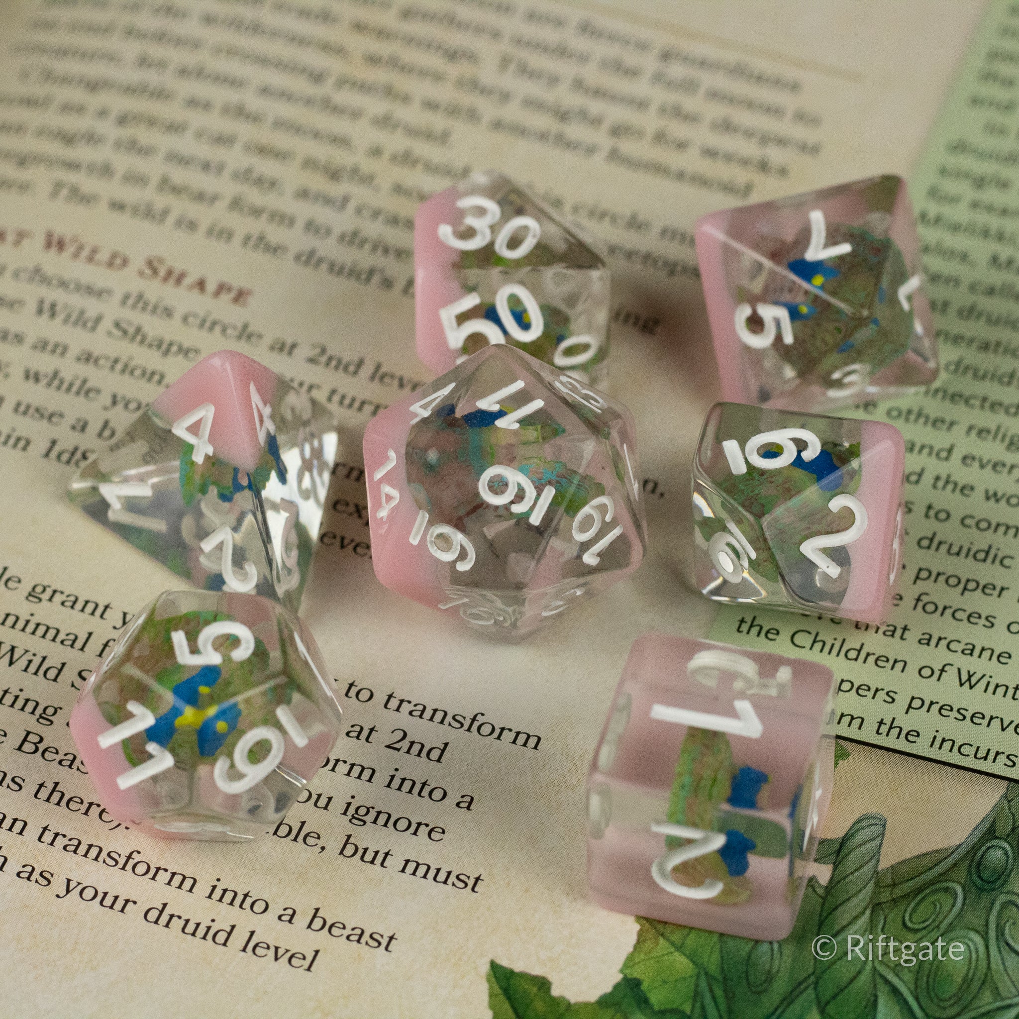 Peacock Dice Set - Translucent pastel dice set with peacock-inspired multicolor swirls and white numbering, includes d4, d6, d8, d10, d12, d20,