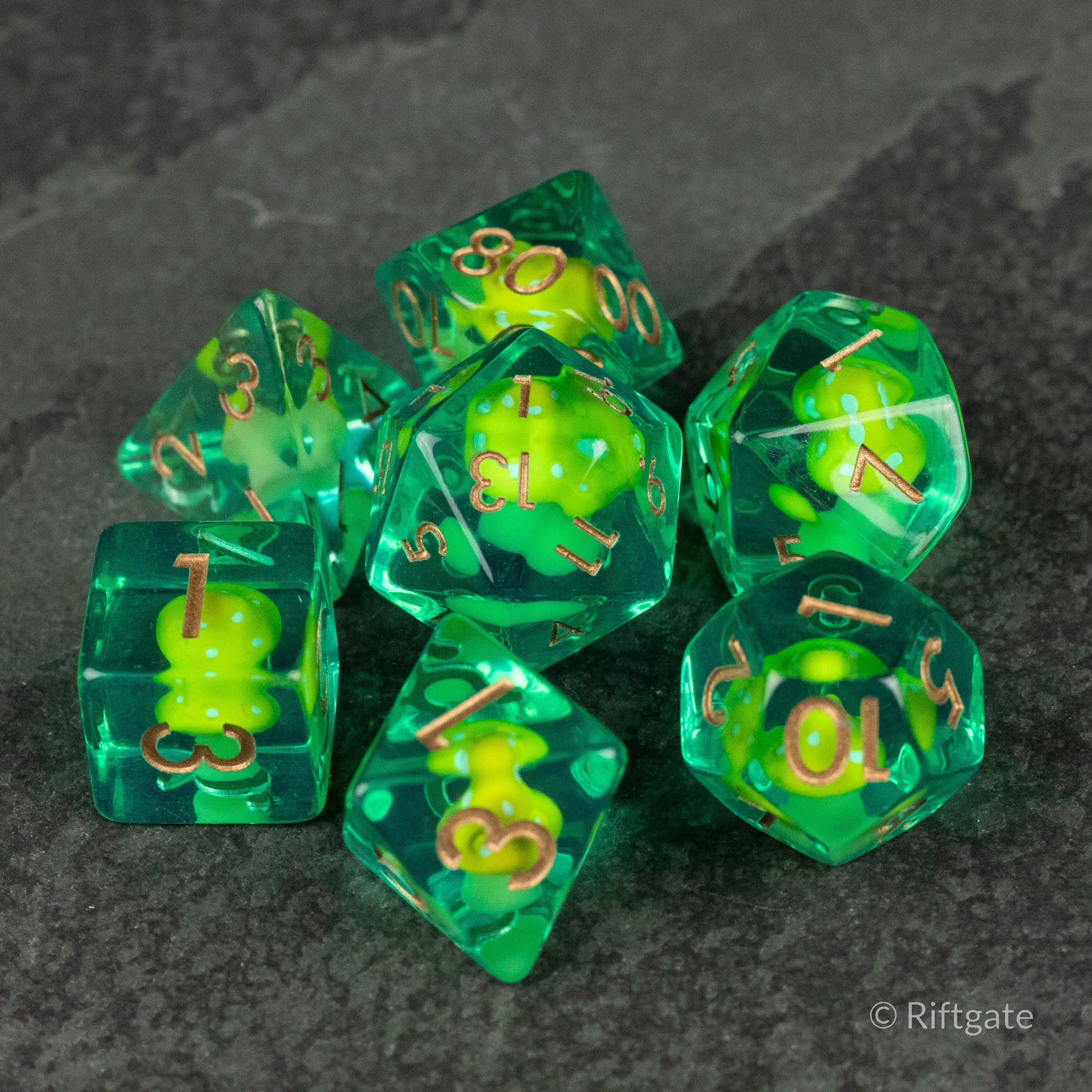 Yellow + Green Resin Mushroom Dice Set - Green resin polyhedral dice set with yellow mushroom inclusions and gold numbers.