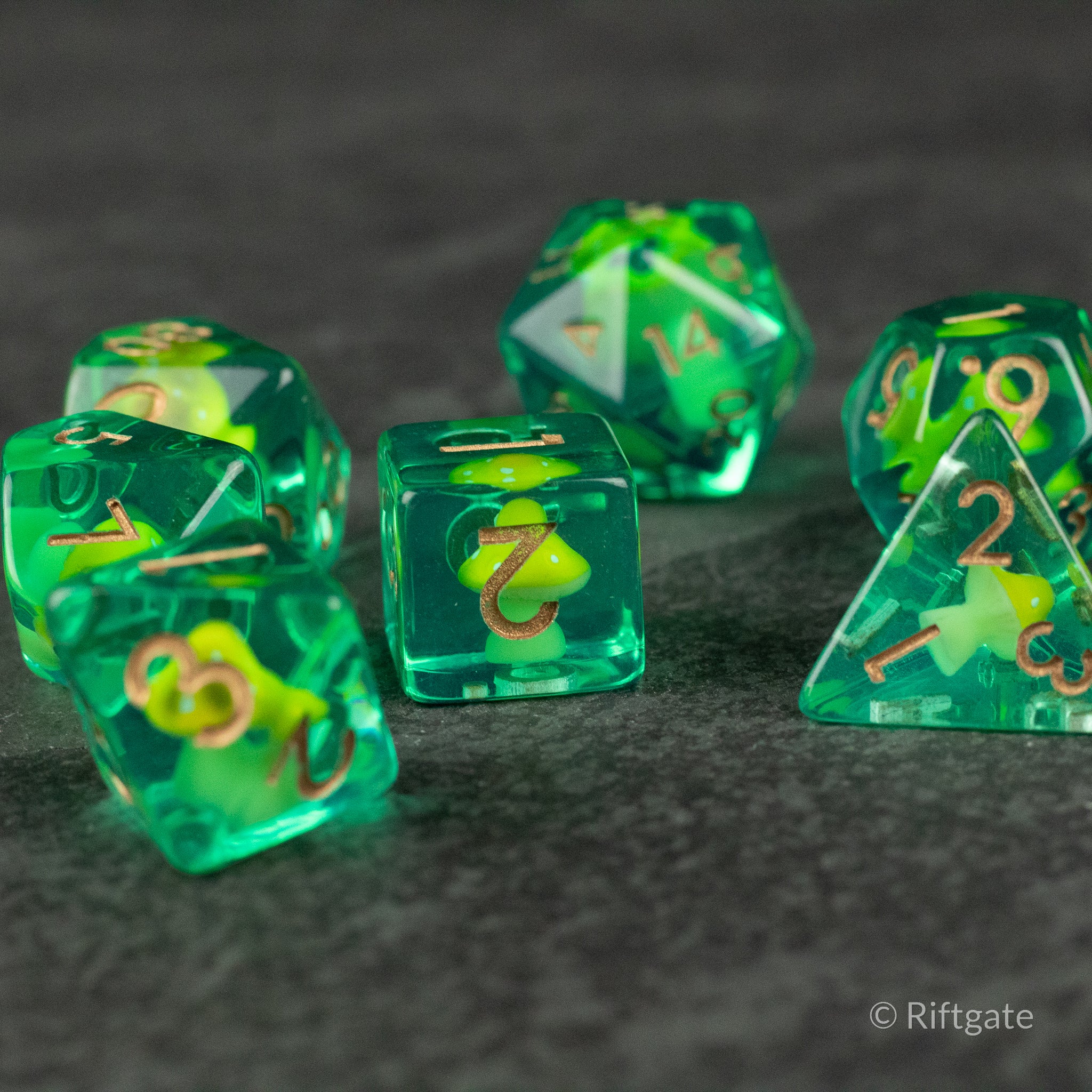 Yellow + Green Resin Mushroom Dice Set - Set of six green translucent resin dice with yellow mushroom inclusions and white numbers.