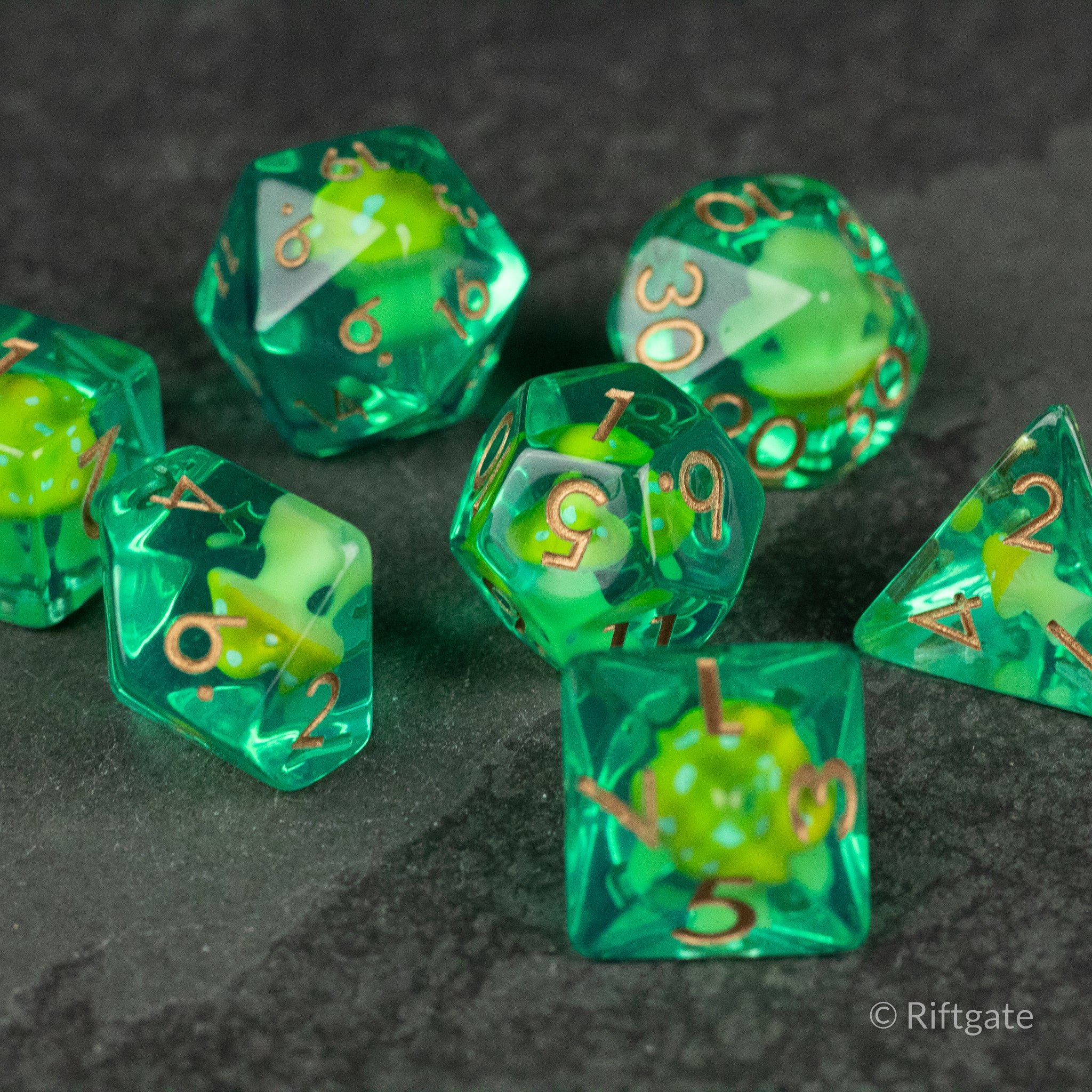 Yellow + Green Resin Mushroom Dice Set - Transparent green resin dice set with embedded yellow mushrooms and gold numbers.
