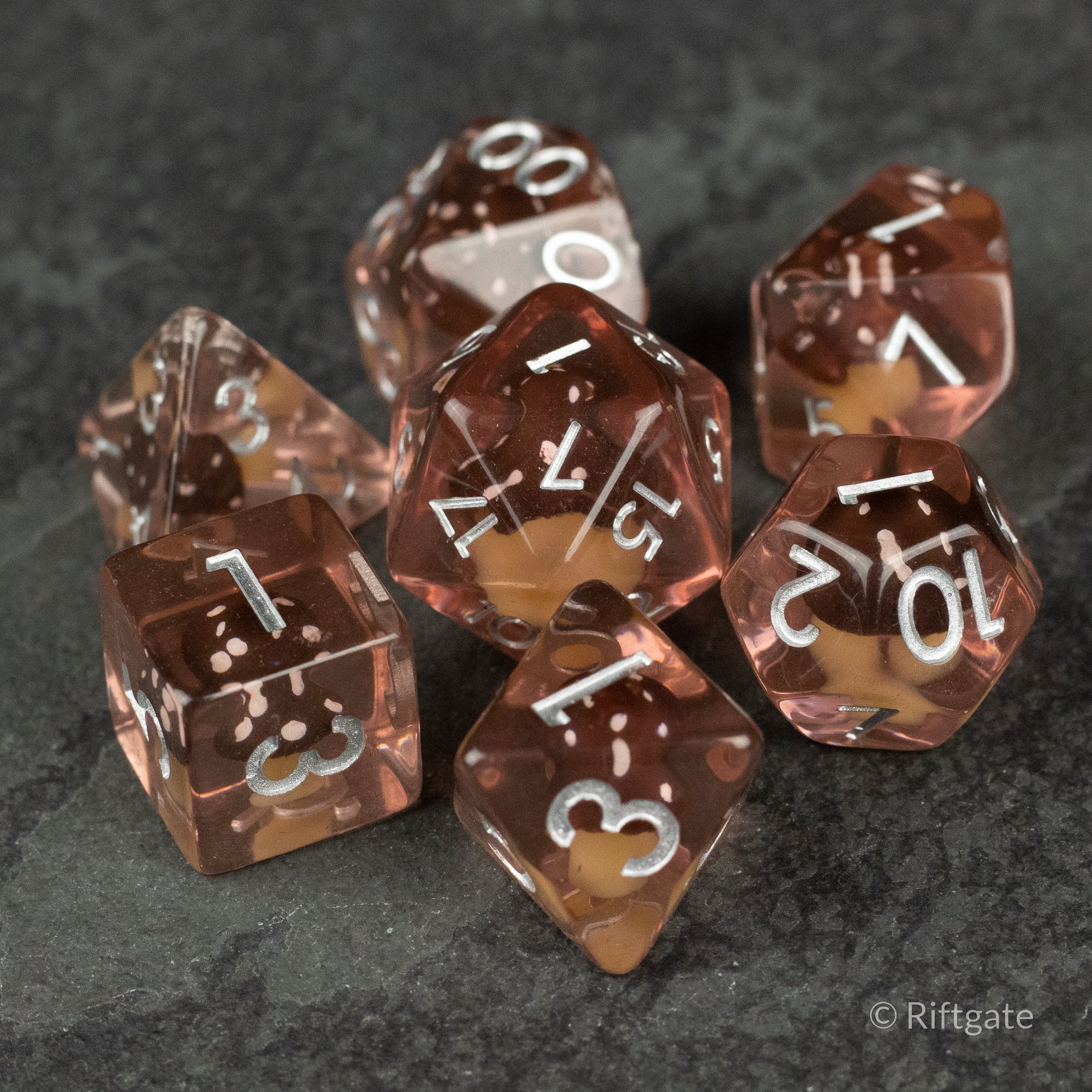 Coffee + Brown Resin Mushroom Dice Set - Set of seven coffee and brown resin polyhedral dice with white numbering and organic inclusions.