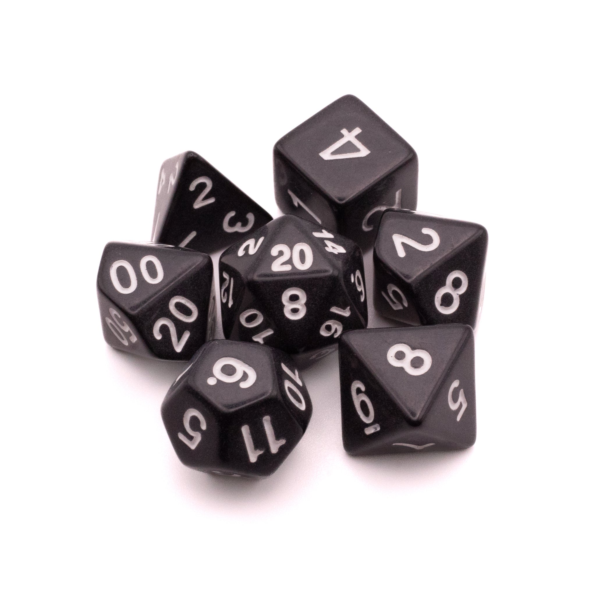 Basic Solid Black Dice Set - Set of seven solid black polyhedral dice with white numbering, including d4, d6, d8, d10, d12, d20, and percentile dice.