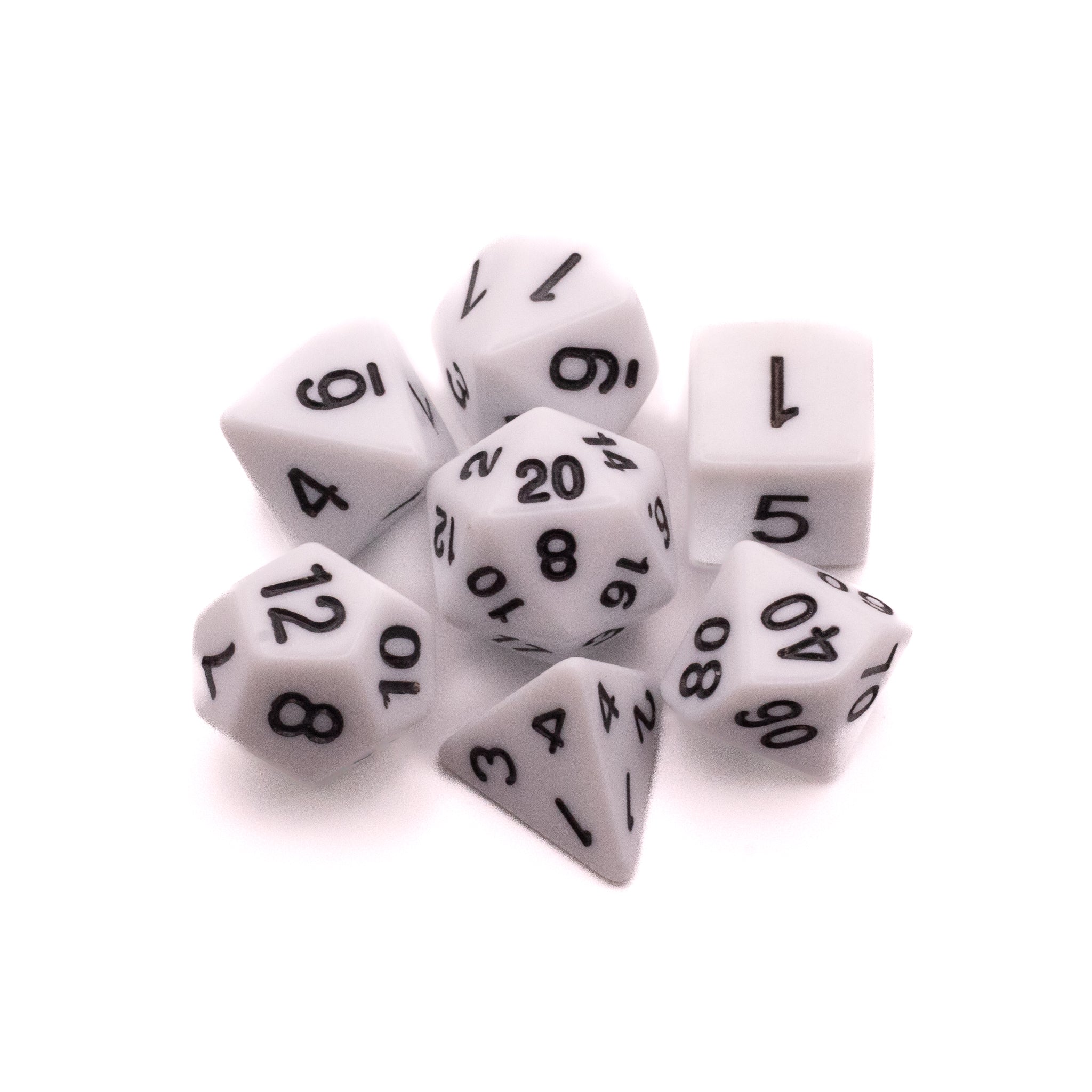 Basic Solid White Dice Set - Set of seven solid white polyhedral dice with black numbers including d4, d6, d8, d10, d12, d20, and percentile dice.