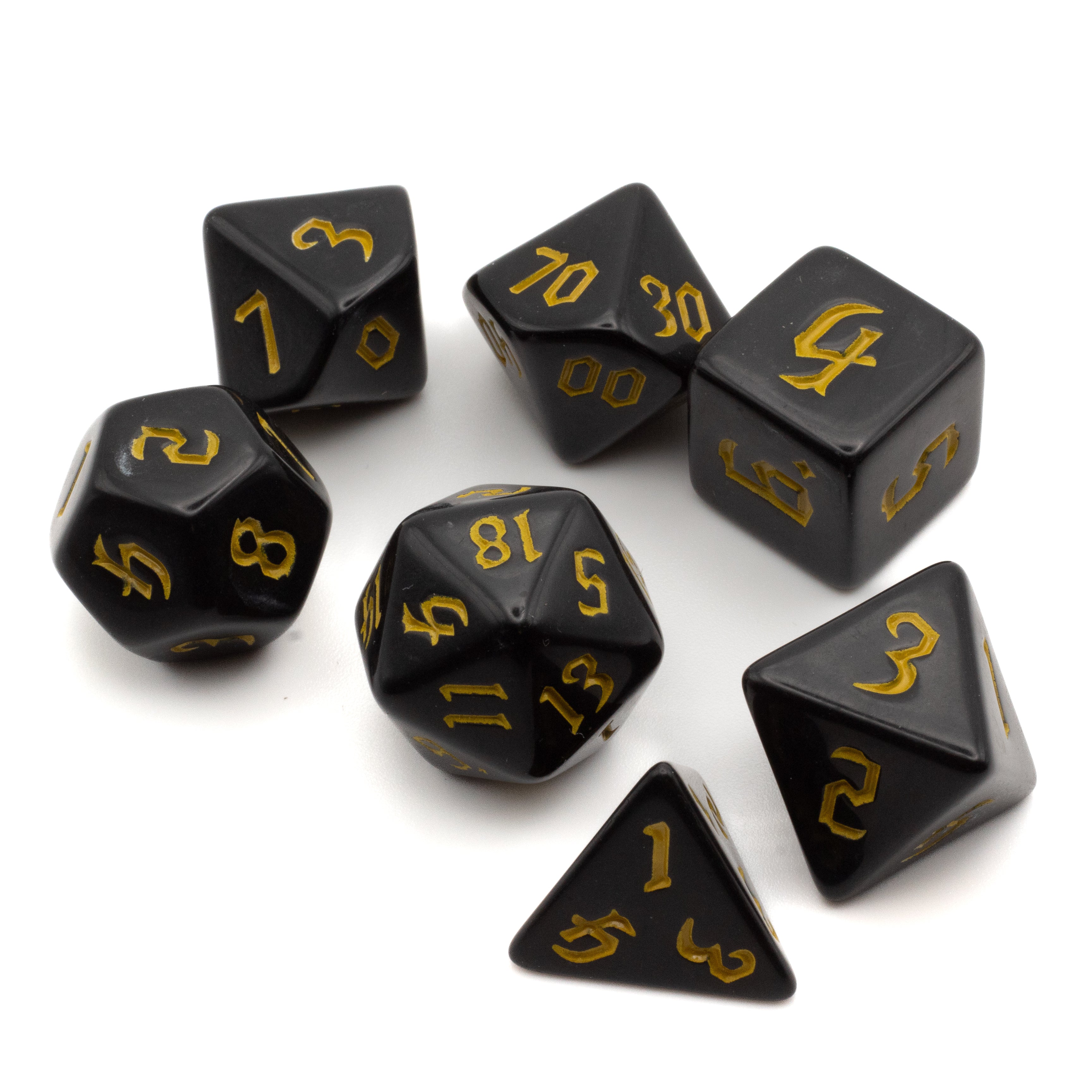 Black Acrylic Dice Set - Yellow - Black acrylic seven-piece dice set with yellow numbering, including d4, d6, d8, d10, percentile, d12, and d20 shapes.