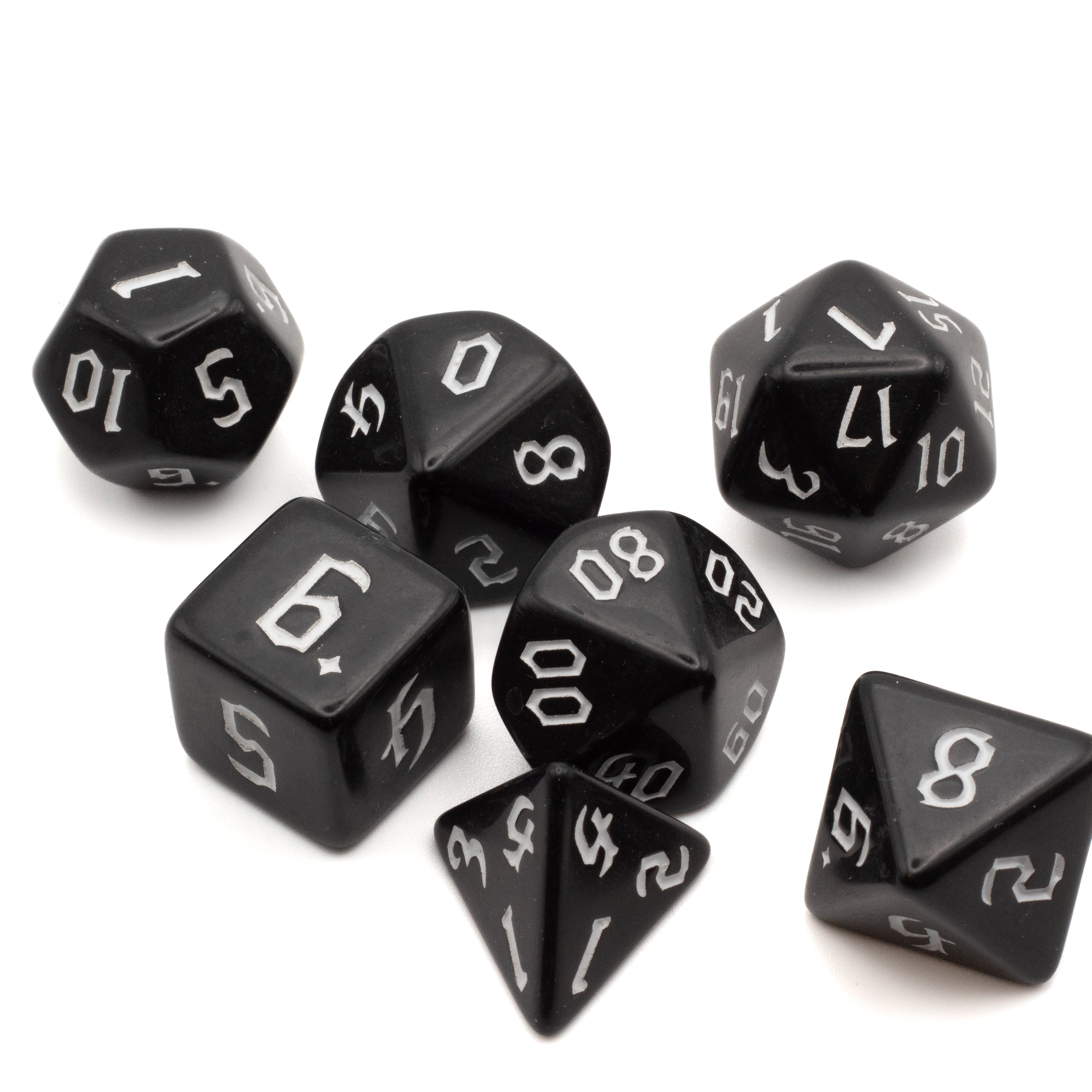 Black Acrylic Dice Set - White - Set of seven black acrylic dice with white numbers, including d4, d6, d8, d10, d12, and d20.