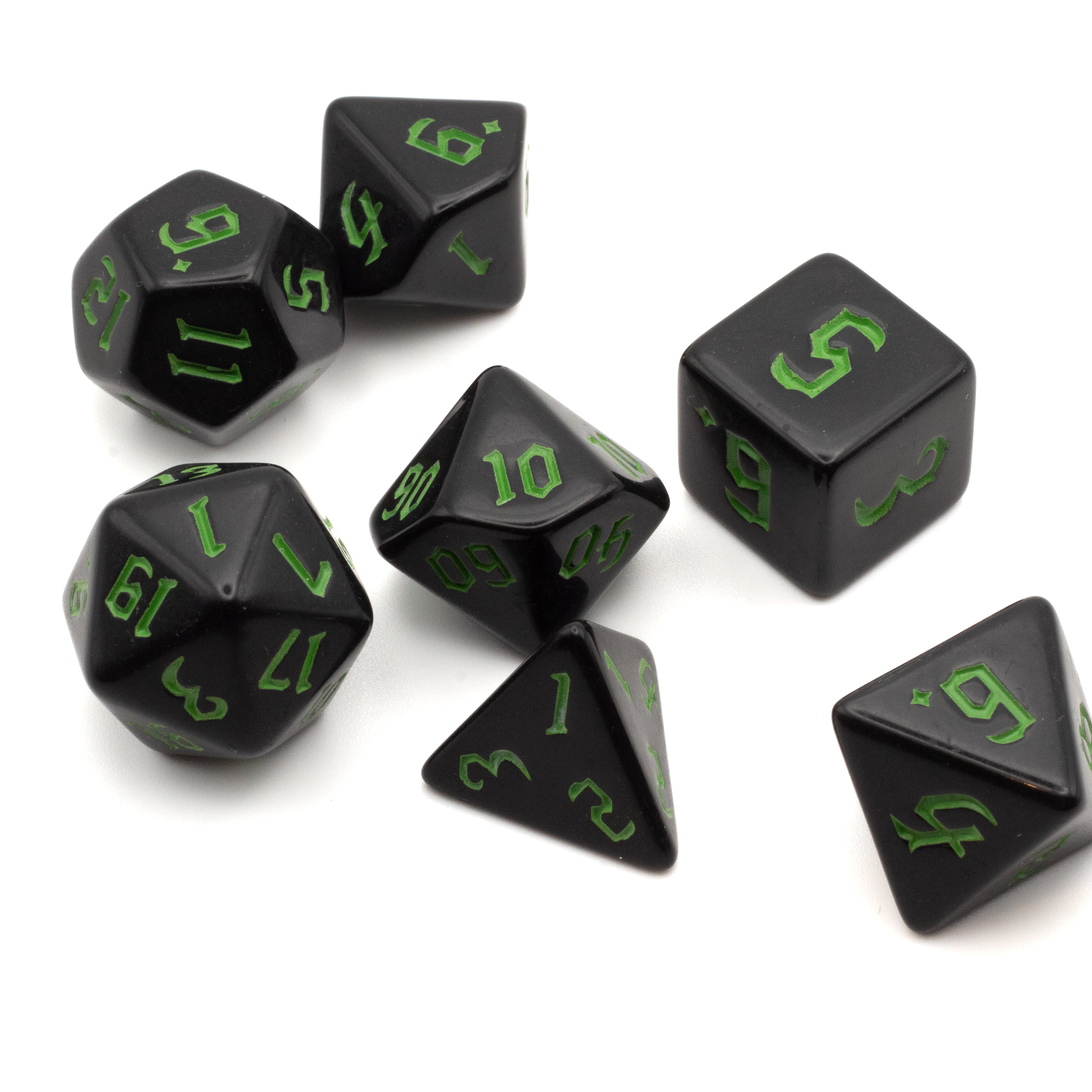 Black Acrylic Dice Set - Green - Set of seven black acrylic dice with green numbers, including d20, d12, d10, d8, d6, d4, and percentile dice.