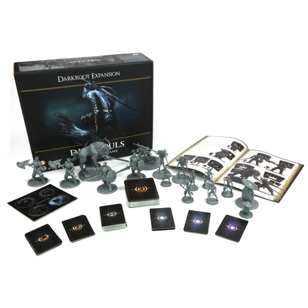 Dark Souls: Darkroot - Darkroot expansion box with detailed miniature figures, game cards, tokens, and open rulebook on white surface.