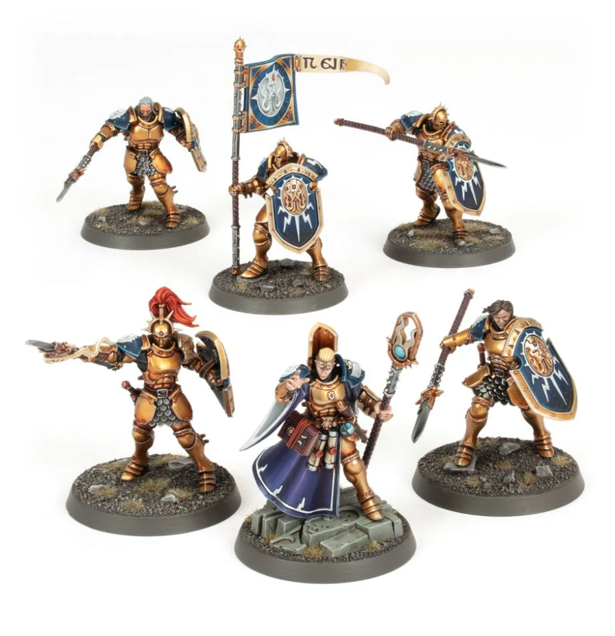 Warhammer Age of Sigmar - Warrior Starter Set - Six detailed Warhammer miniatures with gold and blue armor, shields, weapons, and one holding a banner and another in a.