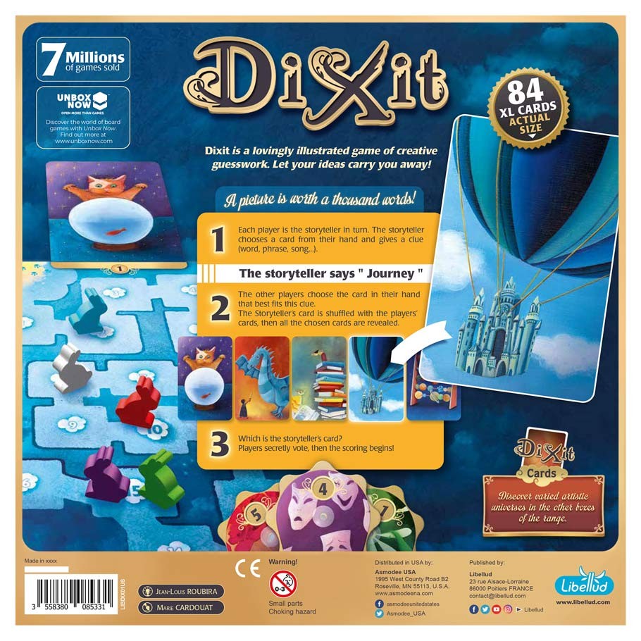 Dixit - Dixit game box with colorful fantasy artwork featuring a hot air balloon, castle, cards, and playful characters on a blue.