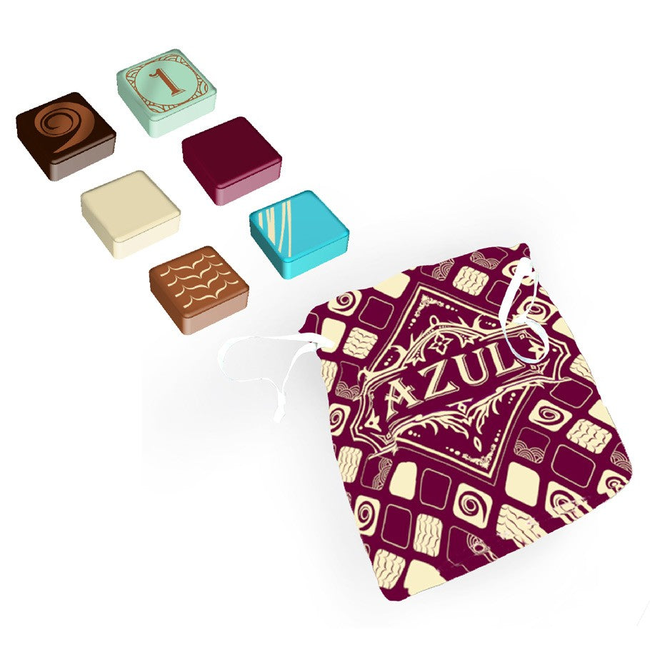 Azul: Master Chocolatier - Colorful square chocolate-themed game tiles with a purple drawstring bag featuring "Azul" text and decorative patterns.
