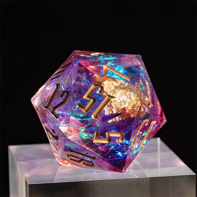 33mm Pink Shimmer D20 - 33mm translucent pink shimmer D20 dice with gold numbers and gold turtle detail on black background.