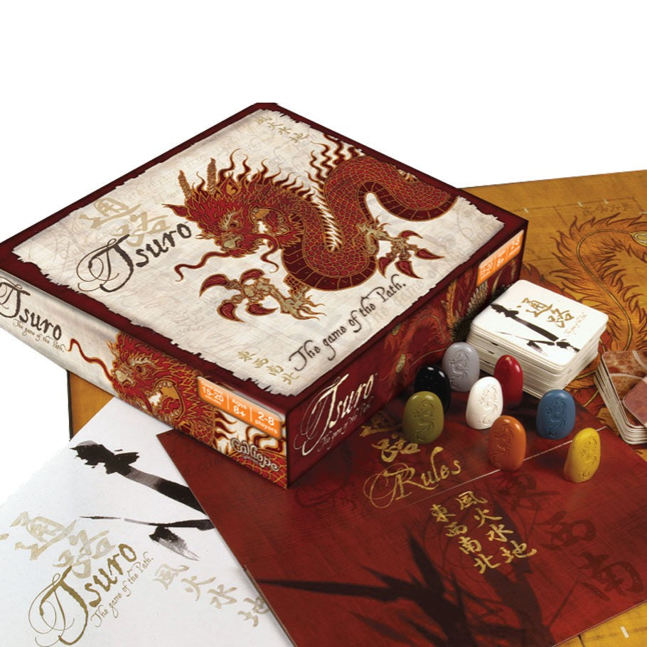 Tsuro: The Game of the Path - Tsuro board game box with dragon artwork, colorful game stones, rulebook, and cards on wooden surface.