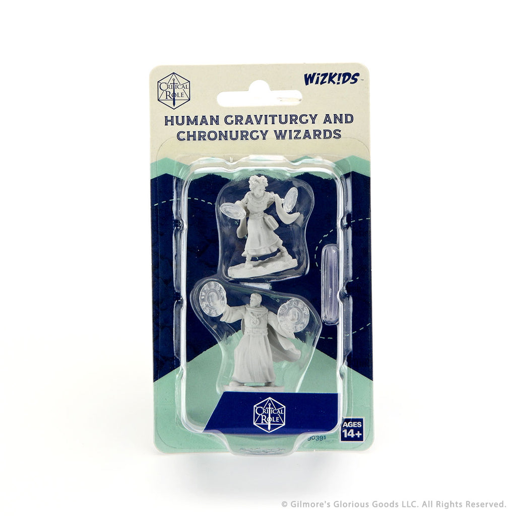 Critical Role Mini: Human Graviturgy & Wiz Female - Two unpainted fantasy wizard miniatures, one holding a staff and the other casting a spell, in clear plastic packaging with.