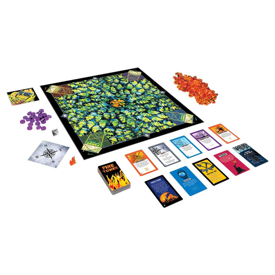 Fire Tower - Fire Tower board game with colorful forest-themed board, playing cards, orange translucent tokens, and purple game pieces.