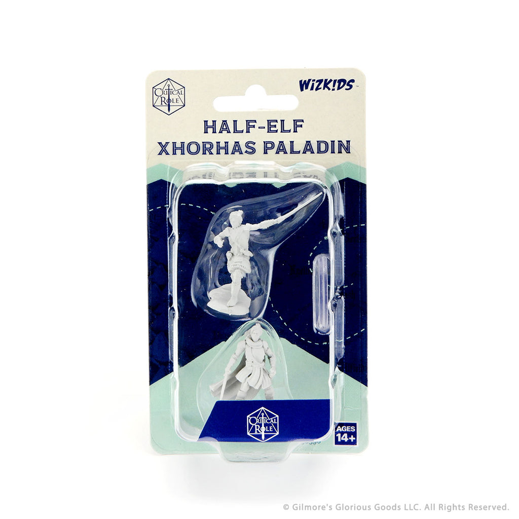 Critical Role Mini: Half-Elf Pally Xhorhas Female - Unpainted miniature of a female half-elf paladin with sword and shield in clear plastic blister pack.