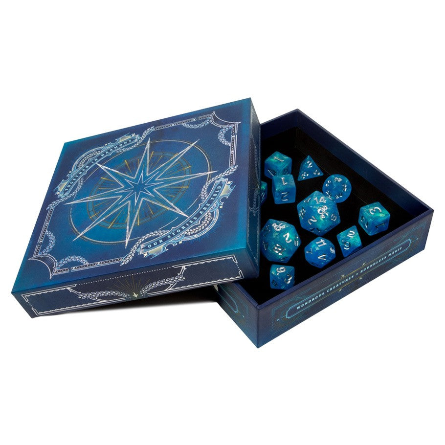 D&D 5E: Forgotten Realms: Explorer's Kit - Blue box with a silver compass design containing a set of blue polyhedral dice with white numbers.