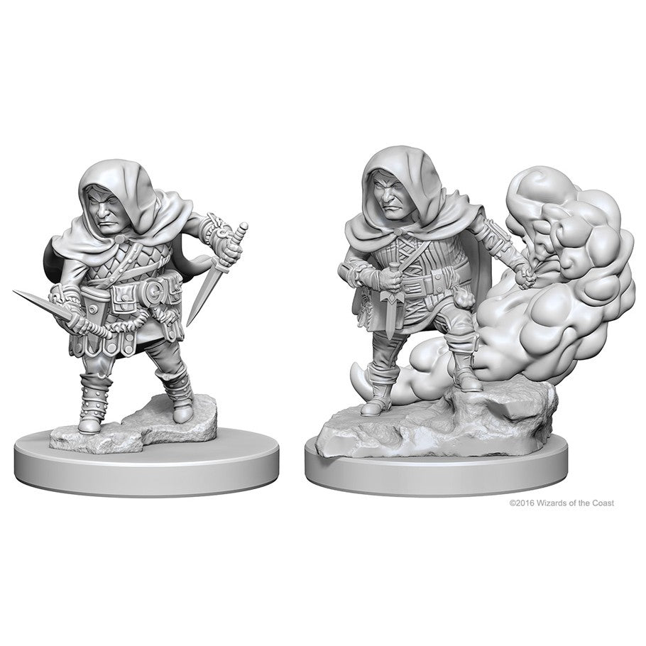 D&D: NMU: Halfling Male Rogue - Gray plastic miniature of a halfling male rogue in a hooded cloak with daggers and pouches, standing on a round base with a.