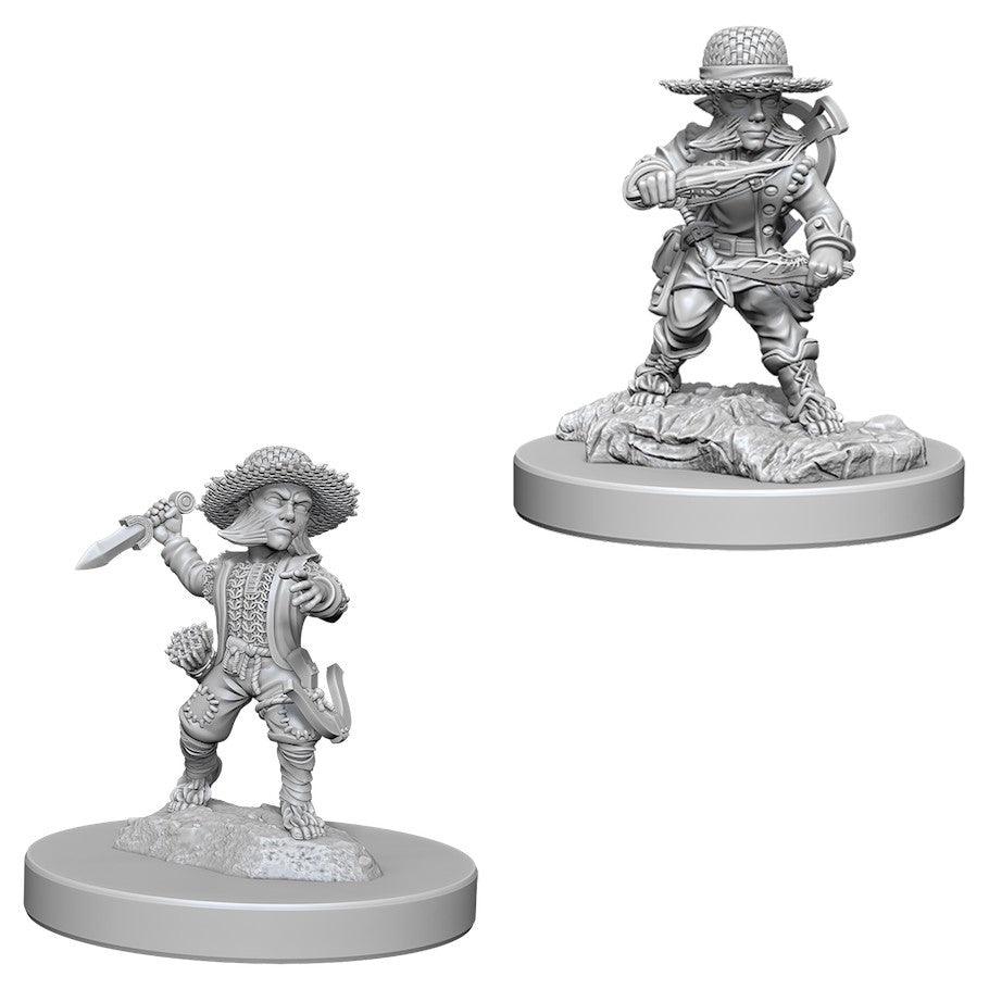 Pathfinder Battles Deep Cuts: Male Halfling Rogue W6 - Unpainted male halfling rogue miniature wielding daggers, detailed fantasy armor, standing on textured base.
