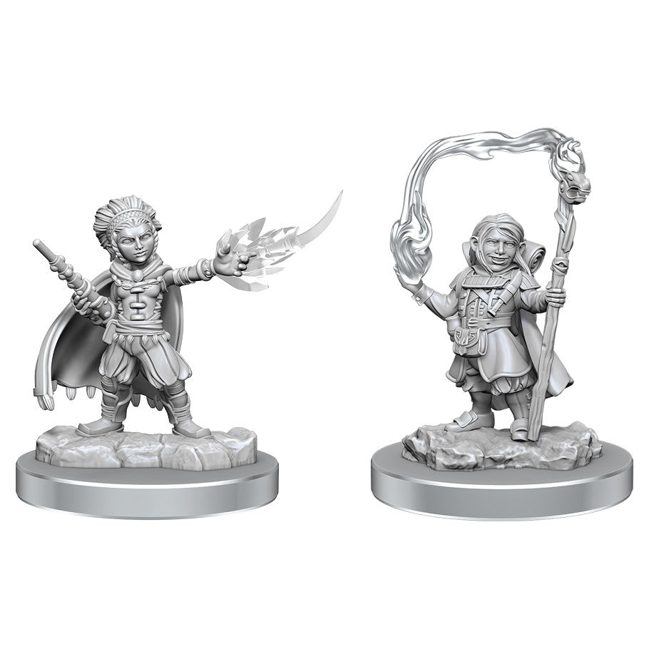 Dungeons & Dragons: Nolzur's Marvelous Minis: Halfling Wizards - Two unpainted halfling wizard miniatures, one casting a fire spell, the other holding a staff with magical energy swirl.