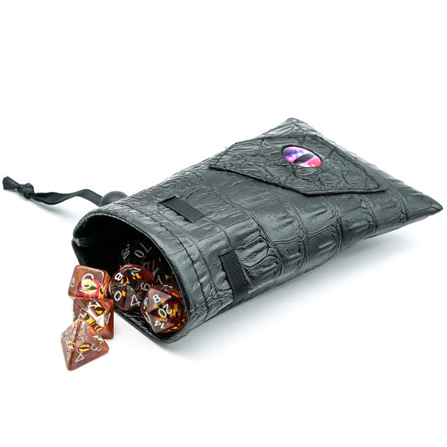 Mimic Dice Bag - Black faux leather dice bag with textured pattern, drawstring closure, and colorful poly dice spilling out.