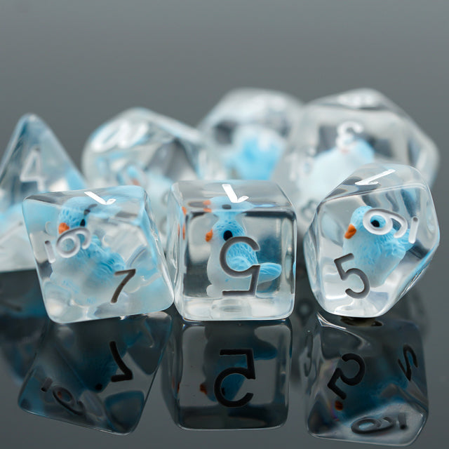 Blue Bird Dice Set - Transparent blue bird-themed polyhedral dice set with white numbers, including d20, d12, d10, d8, d6, and d4, on black.