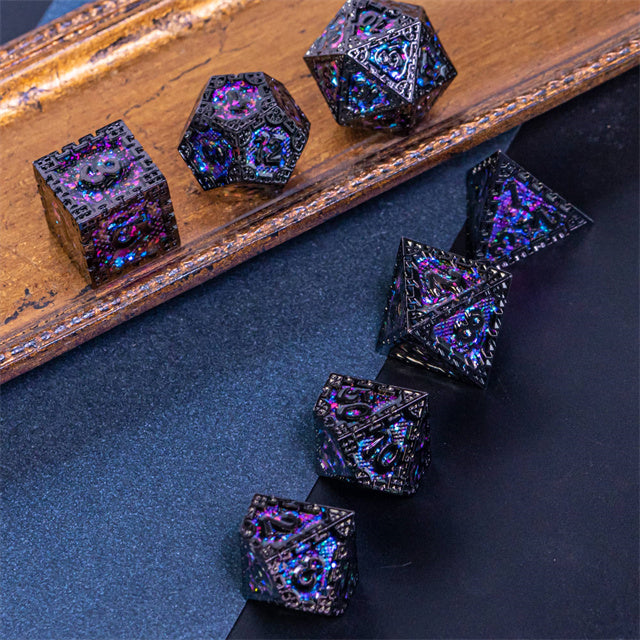 Purple Cathedral Glass Metal Dice Set - Set of seven purple and black metal dice with iridescent glass-like finish, assorted polyhedral shapes.